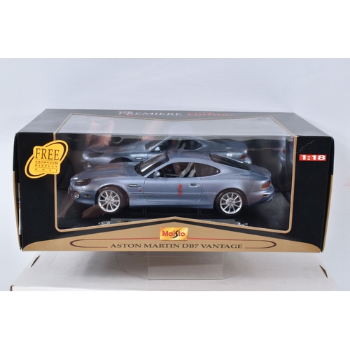 122 - FIVE BOXED AND FOUR LOOSE MODEL VEHICLES,  boxed models include a 1:18 scale Maisto Aston Martin DB7... 