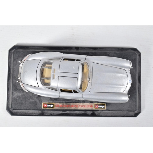 122 - FIVE BOXED AND FOUR LOOSE MODEL VEHICLES,  boxed models include a 1:18 scale Maisto Aston Martin DB7... 