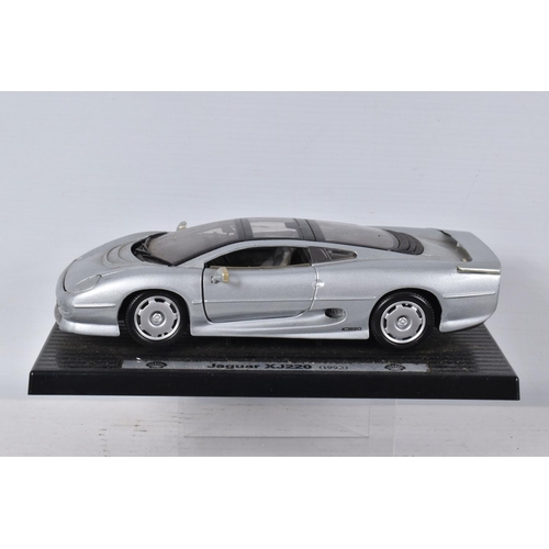 122 - FIVE BOXED AND FOUR LOOSE MODEL VEHICLES,  boxed models include a 1:18 scale Maisto Aston Martin DB7... 