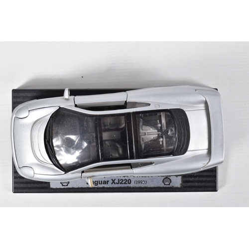 122 - FIVE BOXED AND FOUR LOOSE MODEL VEHICLES,  boxed models include a 1:18 scale Maisto Aston Martin DB7... 