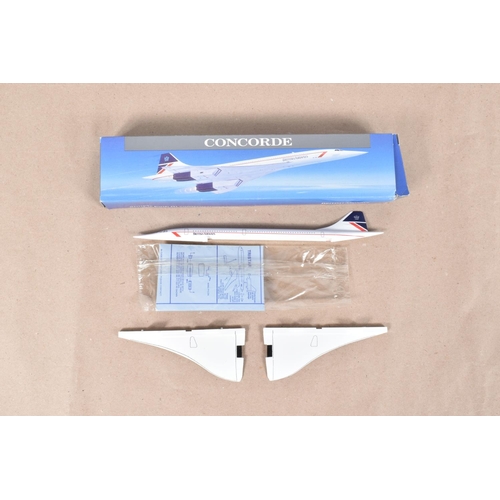 218 - THREE CONCORDE FOLDERS AND A MODEL TOY OF THE AIRCRAFT, the boxed model with British Airways to the ... 