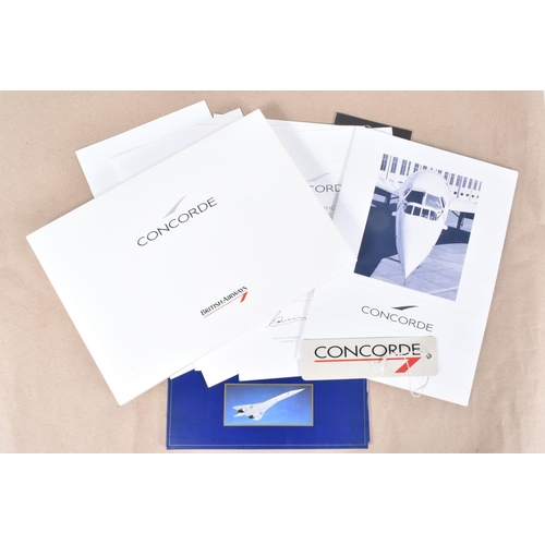 218 - THREE CONCORDE FOLDERS AND A MODEL TOY OF THE AIRCRAFT, the boxed model with British Airways to the ... 