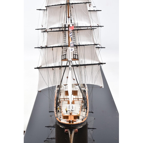 225 - A CONSTRUCTED REVELL PLASTIC KIT OF THE CUTTY SARK HOUSED IN A PERSPEX DISPLAY CASE, kit has been co... 