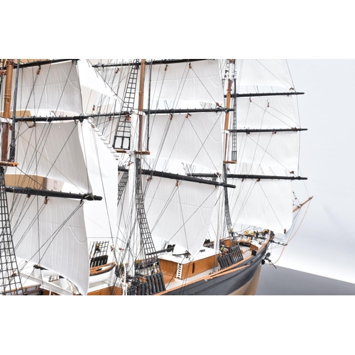 225 - A CONSTRUCTED REVELL PLASTIC KIT OF THE CUTTY SARK HOUSED IN A PERSPEX DISPLAY CASE, kit has been co... 