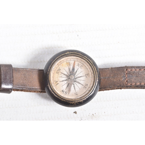 537 - A WWI ERA FLYERS WRIST COMPASS, a pocket compass and a set of RFC cloth wings, the wrist compass com... 