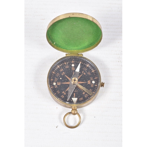 537 - A WWI ERA FLYERS WRIST COMPASS, a pocket compass and a set of RFC cloth wings, the wrist compass com... 