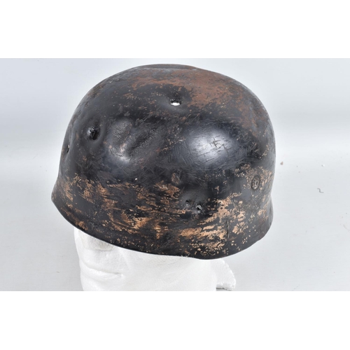 539 - A WWII RELIC OF A GERMAN HELMET, this appears to be a Fallschirmjager or Paratroopers helmet, the ve... 