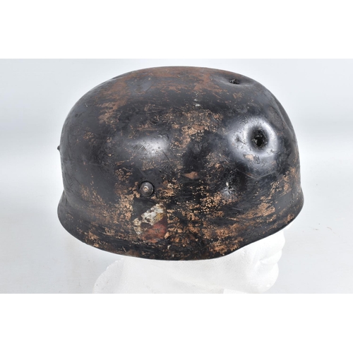 539 - A WWII RELIC OF A GERMAN HELMET, this appears to be a Fallschirmjager or Paratroopers helmet, the ve... 