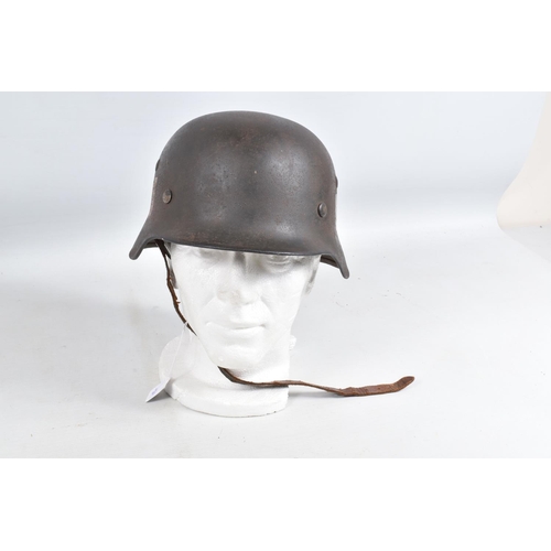 540 - A WWII ERA GERMAN STEEL HELMET WITH DOUBLE DECALS, we believe this to be an M35 helmet, it is comple... 