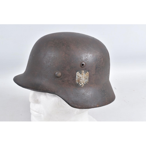 540 - A WWII ERA GERMAN STEEL HELMET WITH DOUBLE DECALS, we believe this to be an M35 helmet, it is comple... 