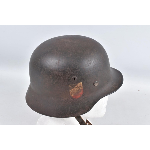 540 - A WWII ERA GERMAN STEEL HELMET WITH DOUBLE DECALS, we believe this to be an M35 helmet, it is comple... 