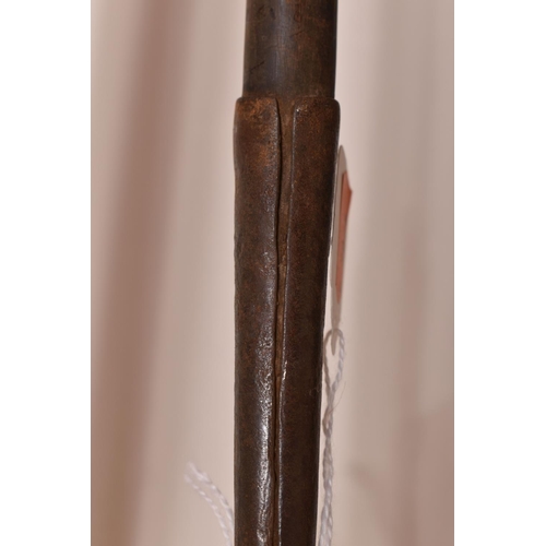 549 - THREE TRIBAL HUNTING SPEARS, the first features a wooden shaft and a grooved arrow shaped steel tip,... 