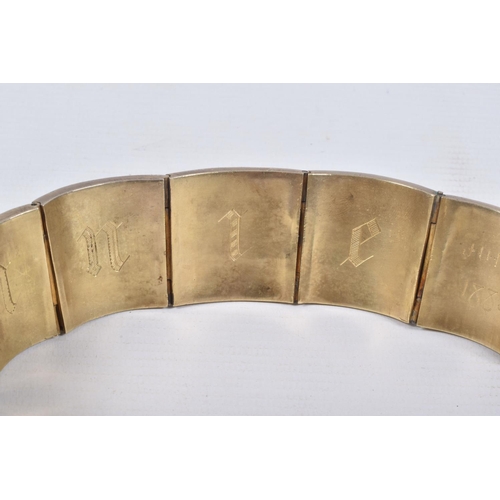 18 - A VICTORIAN GILT BRACELET, comprised of six slightly tapered panels, embossed with an Indian design,... 