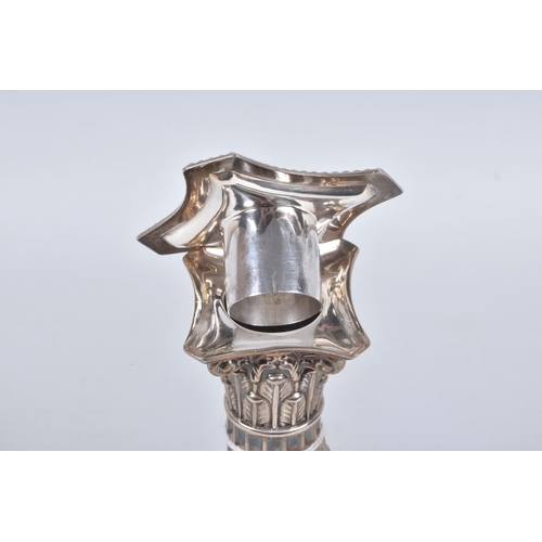 19 - A PAIR OF LATE VICTORIAN SILVER CANDLE STICKS, Corinthian columns scroll leaf detail, on square step... 