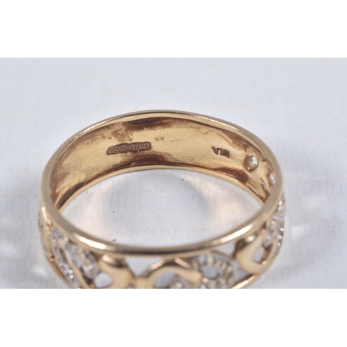 22 - A 9CT GOLD BAND RING, open work wide band, detailed with hearts set with single cut diamond accents,... 