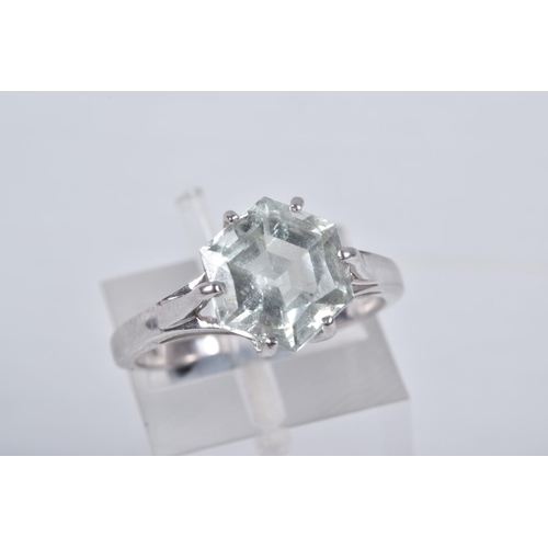 33 - A MODERN 9CT WHITE GOLD BERYL SINGLE STONE RING, set with a hexagonal shaped mixed cut pale green be... 