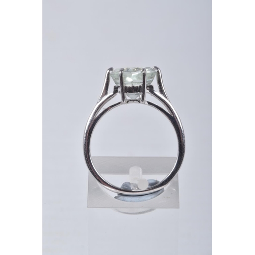 33 - A MODERN 9CT WHITE GOLD BERYL SINGLE STONE RING, set with a hexagonal shaped mixed cut pale green be... 