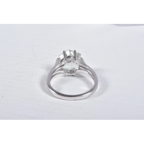 33 - A MODERN 9CT WHITE GOLD BERYL SINGLE STONE RING, set with a hexagonal shaped mixed cut pale green be... 