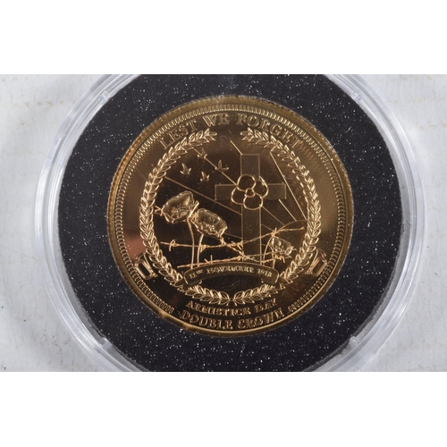 39 - A 9CT COMMEMORATIVE DOUBLE CROWN PROOF COIN, commemorating Armistice day, dated 2015, stated weight ... 