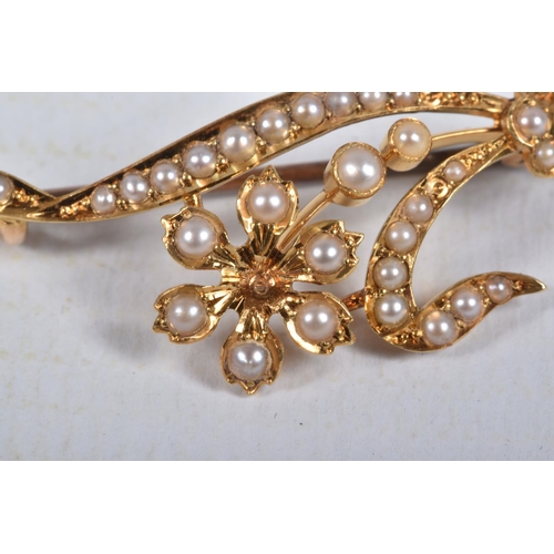 42 - A SPLIT PEARL FLOWER BROOCH, unmarked, length 44mm, approximate weight 3.8 grams (condition report; ... 