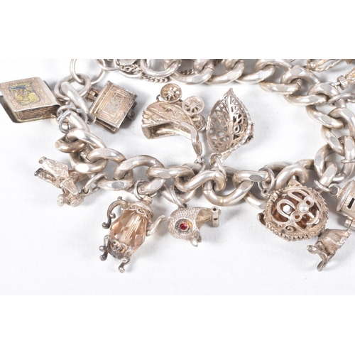 58 - A SILVER CHARM BRACELET, a heavy curb link bracelet fitted with a heart padlock clasp, hallmarked 'J... 