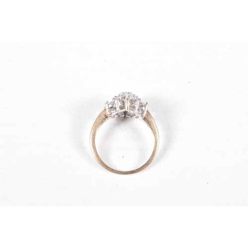 74 - A 9CT GOLD DIAMOND CLUSTER RING, nineteen round brilliant cut diamonds and six baguette cut diamonds... 