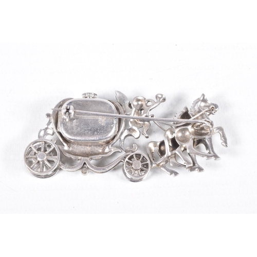 78 - A WHITE METAL WATCH BROOCH, designed as a carriage with a cherub and two horses, set with marcasite,... 