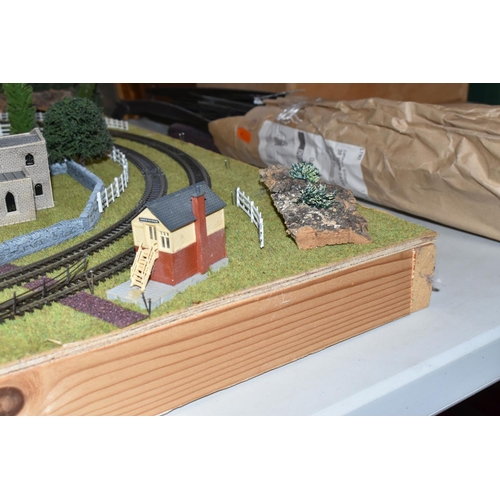 387 - A TABLE TOP N GAUGE MODEL RAILWAY LAYOUT, hardboard base mounted on timber battens, oval double trac... 