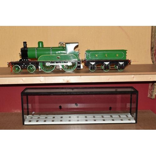 388 - A FIVE INCH GAUGE MODEL OF A NORTH EASTERN RAILWAY CLASS F 4-4-0 LOCOMOTIVE AND TENDER, No.779, in N... 