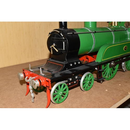 388 - A FIVE INCH GAUGE MODEL OF A NORTH EASTERN RAILWAY CLASS F 4-4-0 LOCOMOTIVE AND TENDER, No.779, in N... 