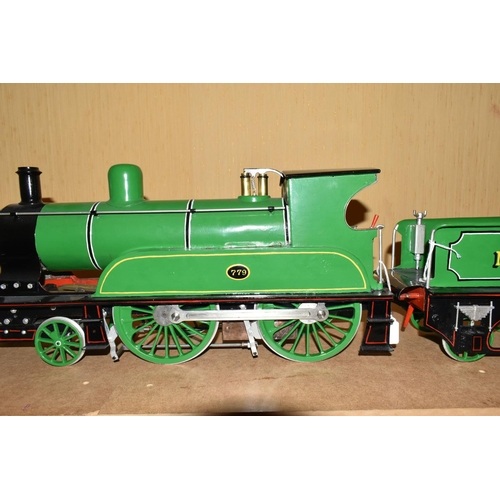 388 - A FIVE INCH GAUGE MODEL OF A NORTH EASTERN RAILWAY CLASS F 4-4-0 LOCOMOTIVE AND TENDER, No.779, in N... 