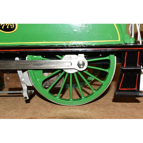 388 - A FIVE INCH GAUGE MODEL OF A NORTH EASTERN RAILWAY CLASS F 4-4-0 LOCOMOTIVE AND TENDER, No.779, in N... 