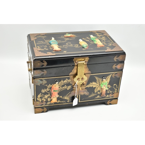 827A - A LATE 20TH CENTURY JAPANESE STYLE BLACK LACQUER JEWELLERY BOX, with decorative brass mounts, gilt d... 