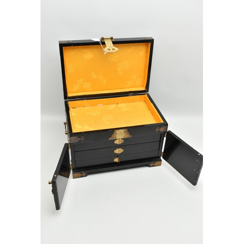 827A - A LATE 20TH CENTURY JAPANESE STYLE BLACK LACQUER JEWELLERY BOX, with decorative brass mounts, gilt d... 