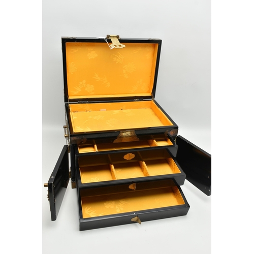 827A - A LATE 20TH CENTURY JAPANESE STYLE BLACK LACQUER JEWELLERY BOX, with decorative brass mounts, gilt d... 