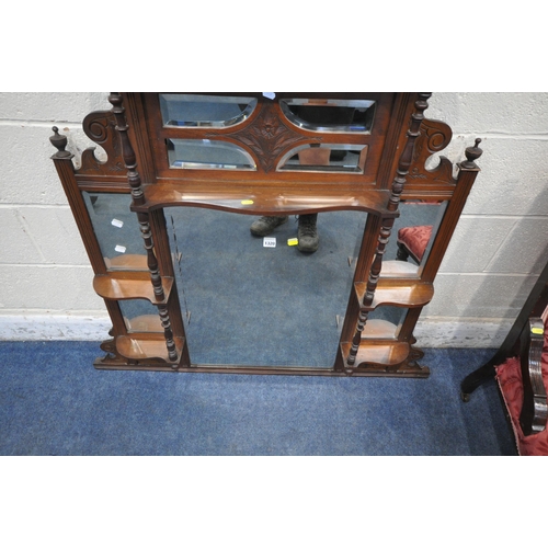 1320 - AN EARLY 20TH CENTURY MAHOGANY OVERMANTEL MIRROR, with broken arch pediment, three finials, turned s... 