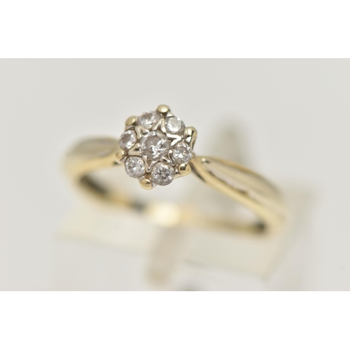 13 - A 9CT GOLD DIAMOND CLUSTER RING, small circular cluster set with seven round brilliant cut diamonds,... 