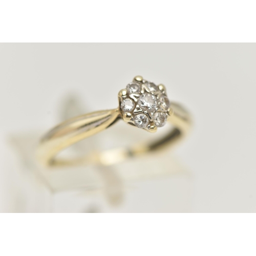 13 - A 9CT GOLD DIAMOND CLUSTER RING, small circular cluster set with seven round brilliant cut diamonds,... 