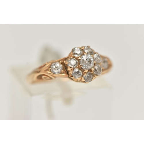 16 - A YELLOW METAL DIAMOND CLUSTER RING, circular cluster set with eight old cut diamonds, flanked with ... 