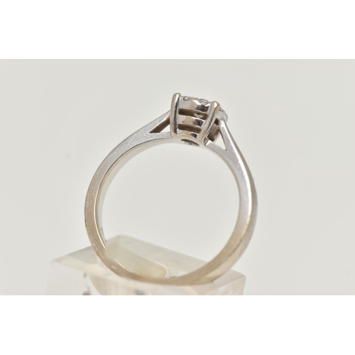 2 - A WHITE METAL DIAMOND CLUSTER RING, centrally set with a round brilliant cut diamond, in a surround ... 