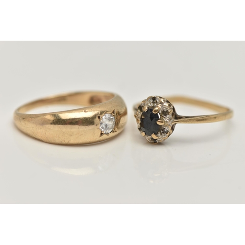 20 - TWO 9CT GOLD RINGS, the first a single circular cut cubic zirconia, star set in a yellow gold domed ... 