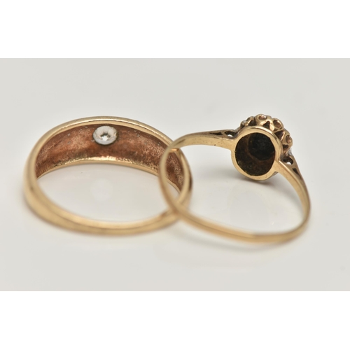 20 - TWO 9CT GOLD RINGS, the first a single circular cut cubic zirconia, star set in a yellow gold domed ... 