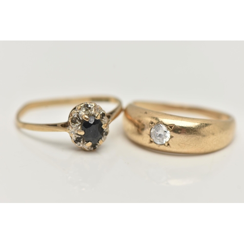 20 - TWO 9CT GOLD RINGS, the first a single circular cut cubic zirconia, star set in a yellow gold domed ... 