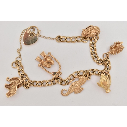 30 - A 9CT GOLD CHARM BRACELET, a double curb link bracelet, fitted with a small heart padlock clasp, hal... 