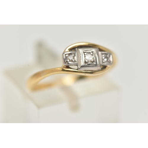 33 - A THREE STONE DIAMOND RING, three single cut diamonds, prong set in white metal, leading on to a yel... 