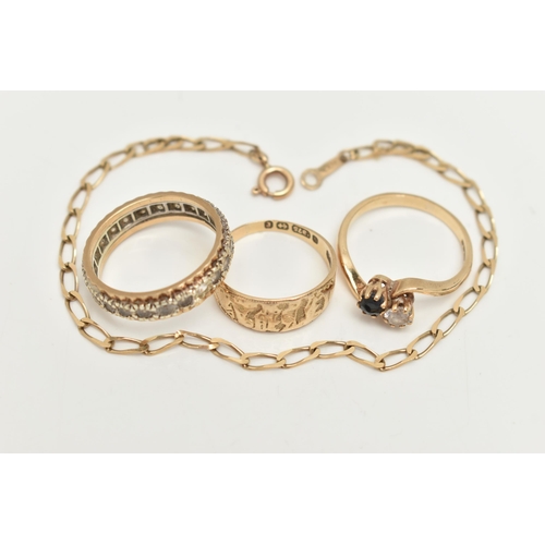 36 - A 9CT GOLD BRACELET AND THREE RINGS, a yellow gold elongated curb link bracelet, fitted with a sprin... 