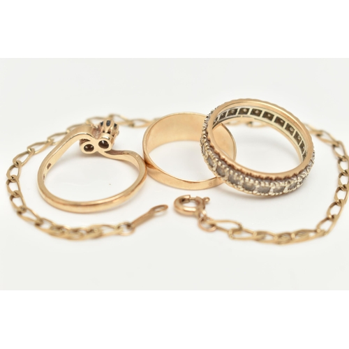 36 - A 9CT GOLD BRACELET AND THREE RINGS, a yellow gold elongated curb link bracelet, fitted with a sprin... 