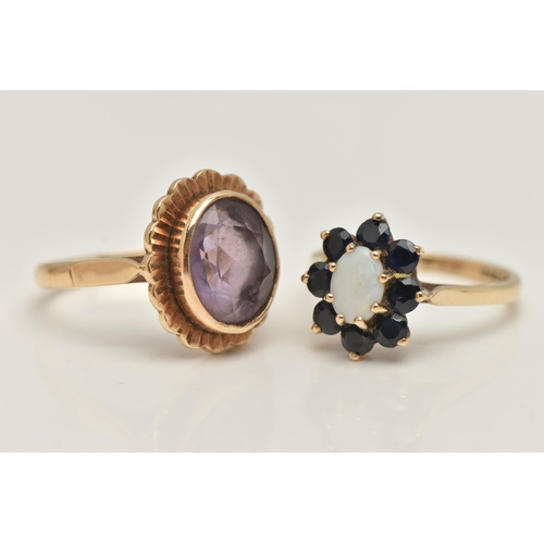 37 - TWO GEM SET RINGS, the first an oval opal set with a surround of circular cut sapphires, prong set i... 