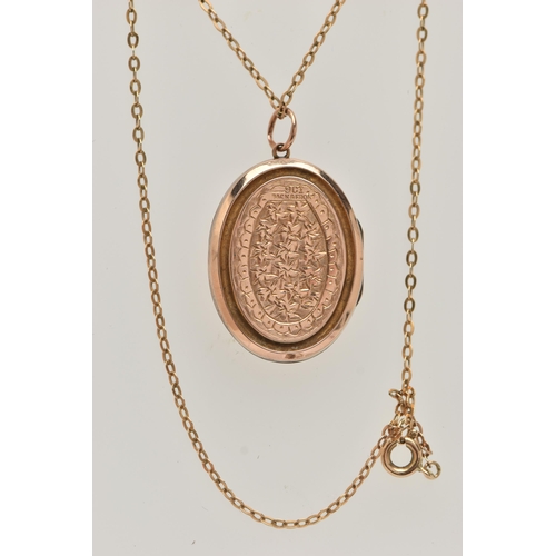 48 - AN EARLY 20TH CENTURY 9CT GOLD FRONT AND BACK LOCKET WITH YELLOW METAL CHAIN, the oval locket with e... 