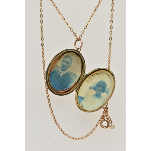 48 - AN EARLY 20TH CENTURY 9CT GOLD FRONT AND BACK LOCKET WITH YELLOW METAL CHAIN, the oval locket with e... 